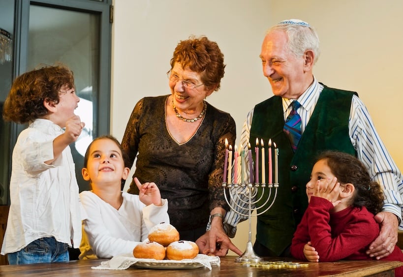 Rakefet Synagogue CRM happy Jewish family lighting the Hannukiah